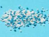 a pile of white and blue colored spheroids