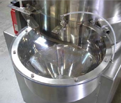 Spheronizer 380 discharge showing air blow off to prevent Accumulation of material